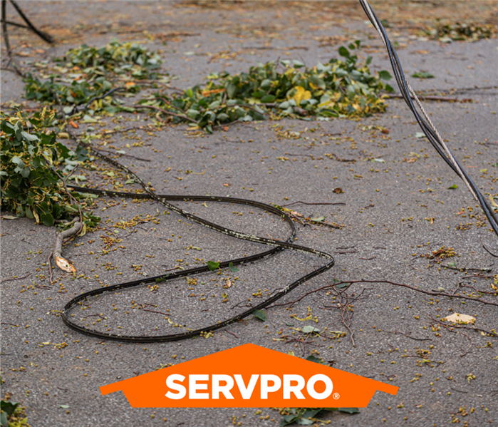 Downed power lines and a SERVPRO logo.